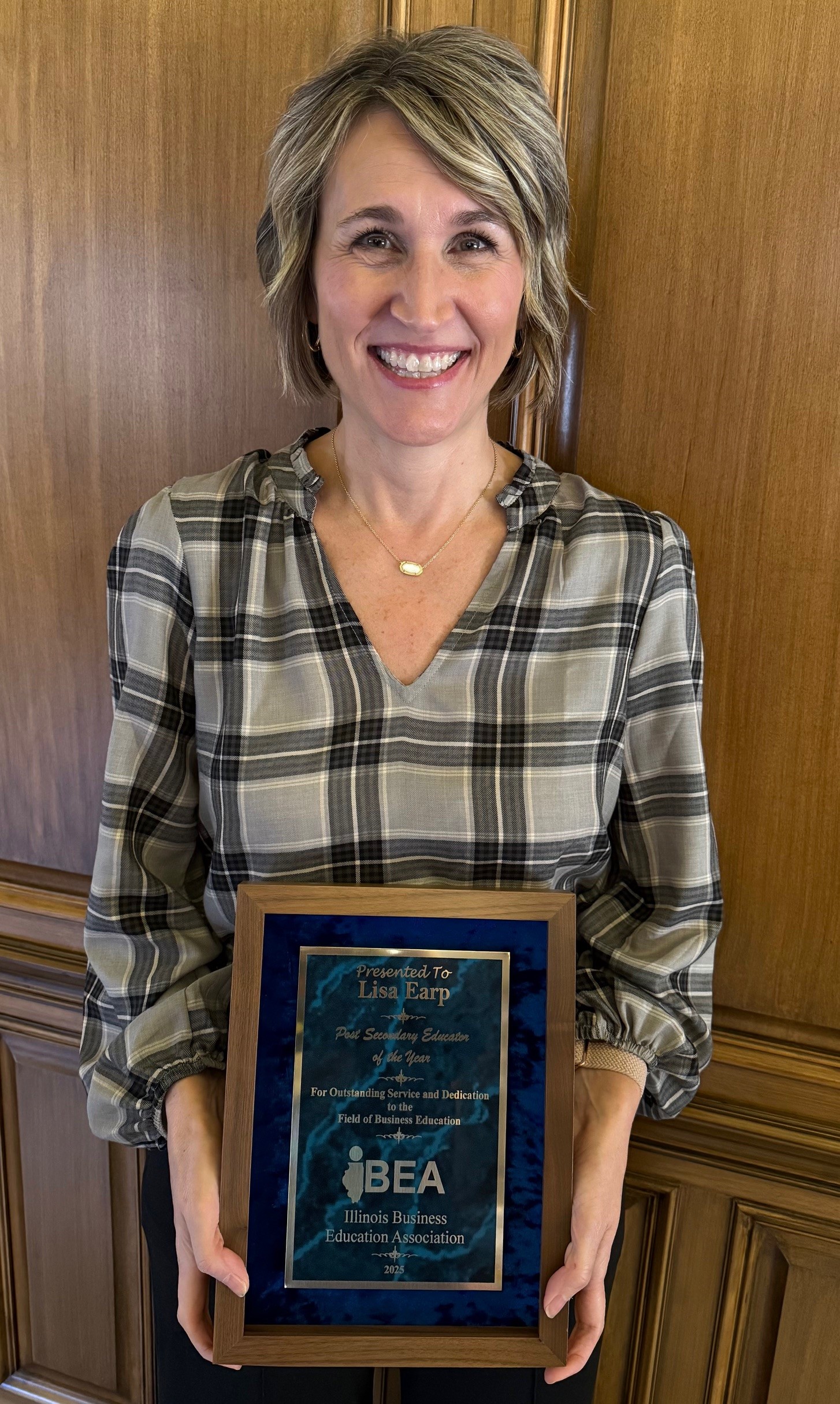 Lisa Earp wins the IBEA Outstanding Post Secondary Teacher of the Year Award